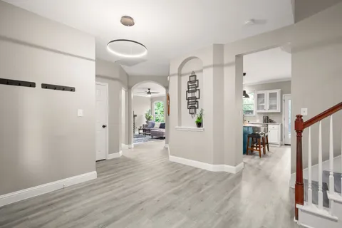 wooden floor in a hall with an entryway