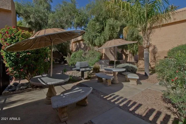 a view of a backyard with sitting area and furniture