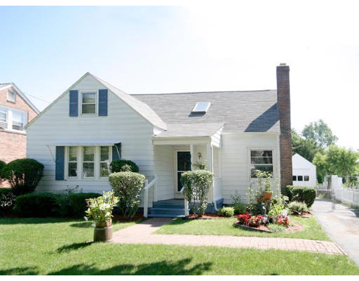 17 Lancaster Street Springfield, MA 01118 - Photo 1 of 15 a front view of a house with a yard and potted plants