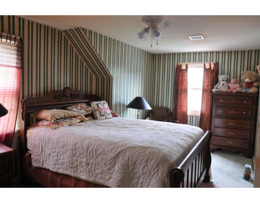 17 Lancaster Street Springfield, MA 01118 - Photo 11 of 15 a bedroom with a bed and a dresser