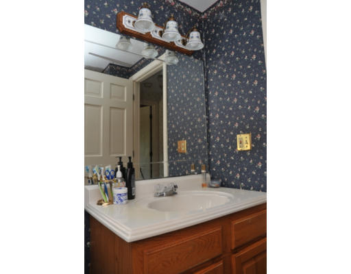 17 Lancaster Street Springfield, MA 01118 - Photo 14 of 15 a bathroom with a sink and a mirror