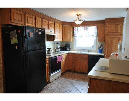 17 Lancaster Street Springfield, MA 01118 - Photo 6 of 15 a kitchen with a refrigerator sink and cabinets