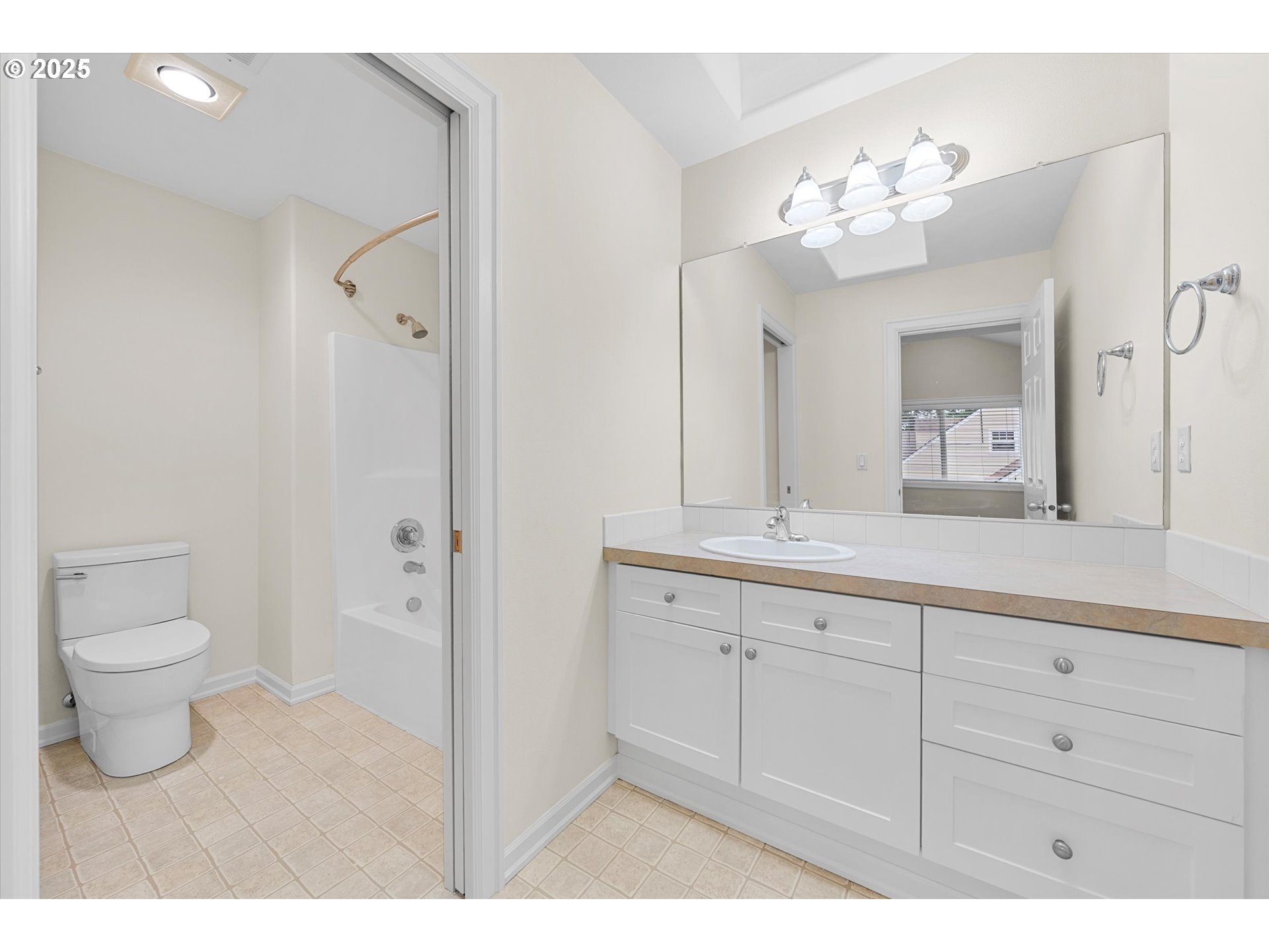 2926 Southwest Texas Street Portland, OR 97219 - Photo 14 of 16 a bathroom with a toilet sink and mirror