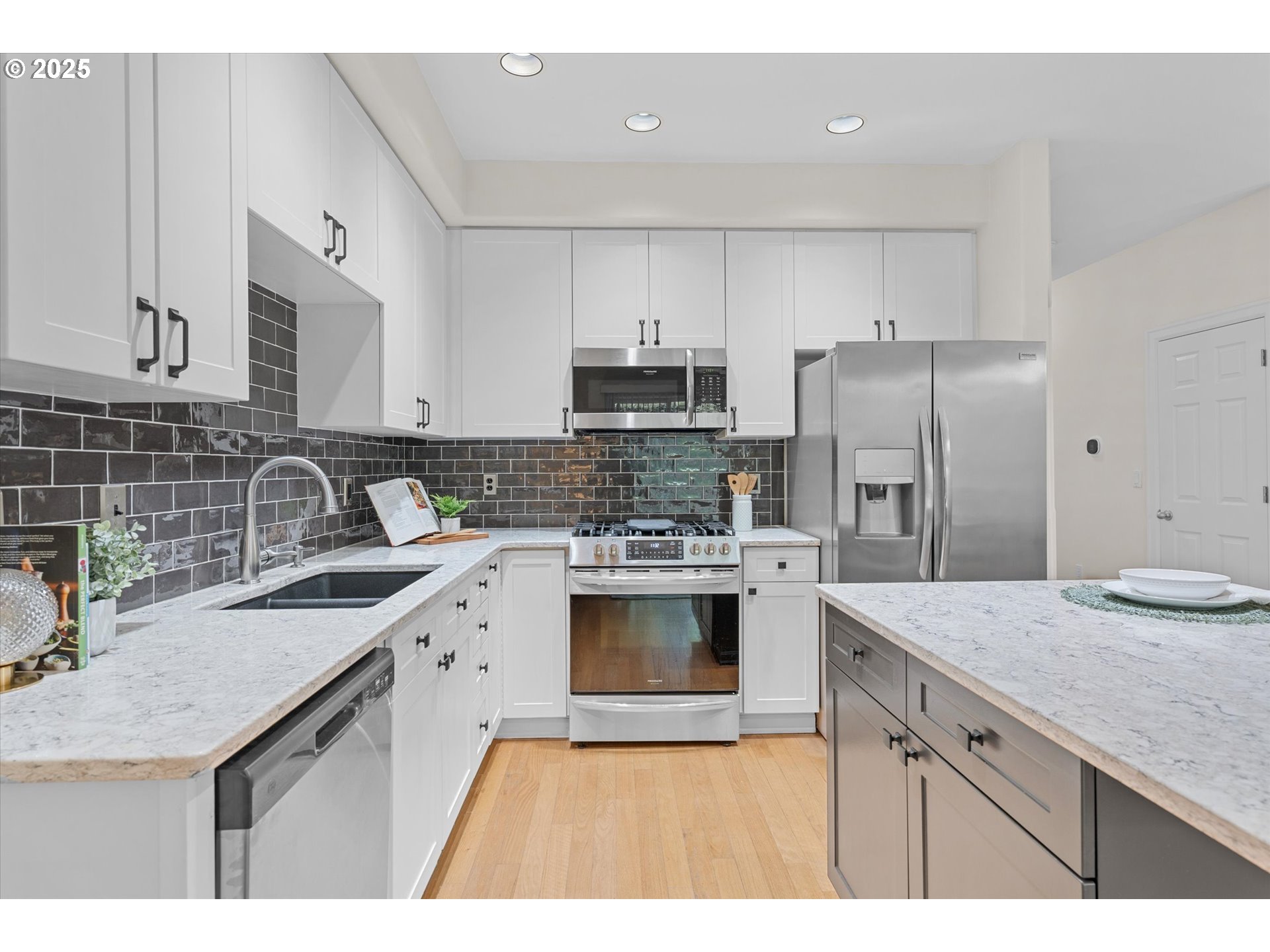 2926 Southwest Texas Street Portland, OR 97219 - Photo 6 of 16 a kitchen with a sink stove and refrigerator