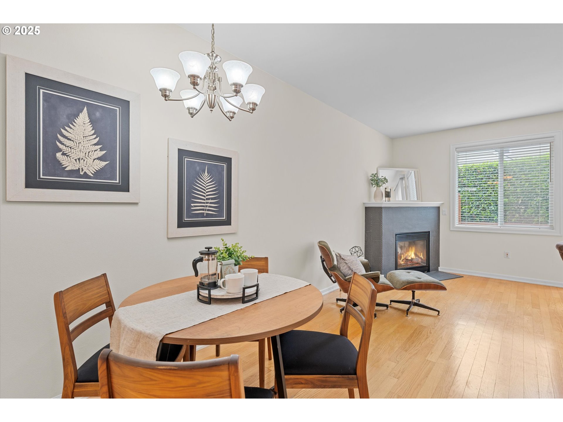 2926 Southwest Texas Street Portland, OR 97219 - Photo 9 of 16 a view of a dining room with furniture a chandelier and wooden floor