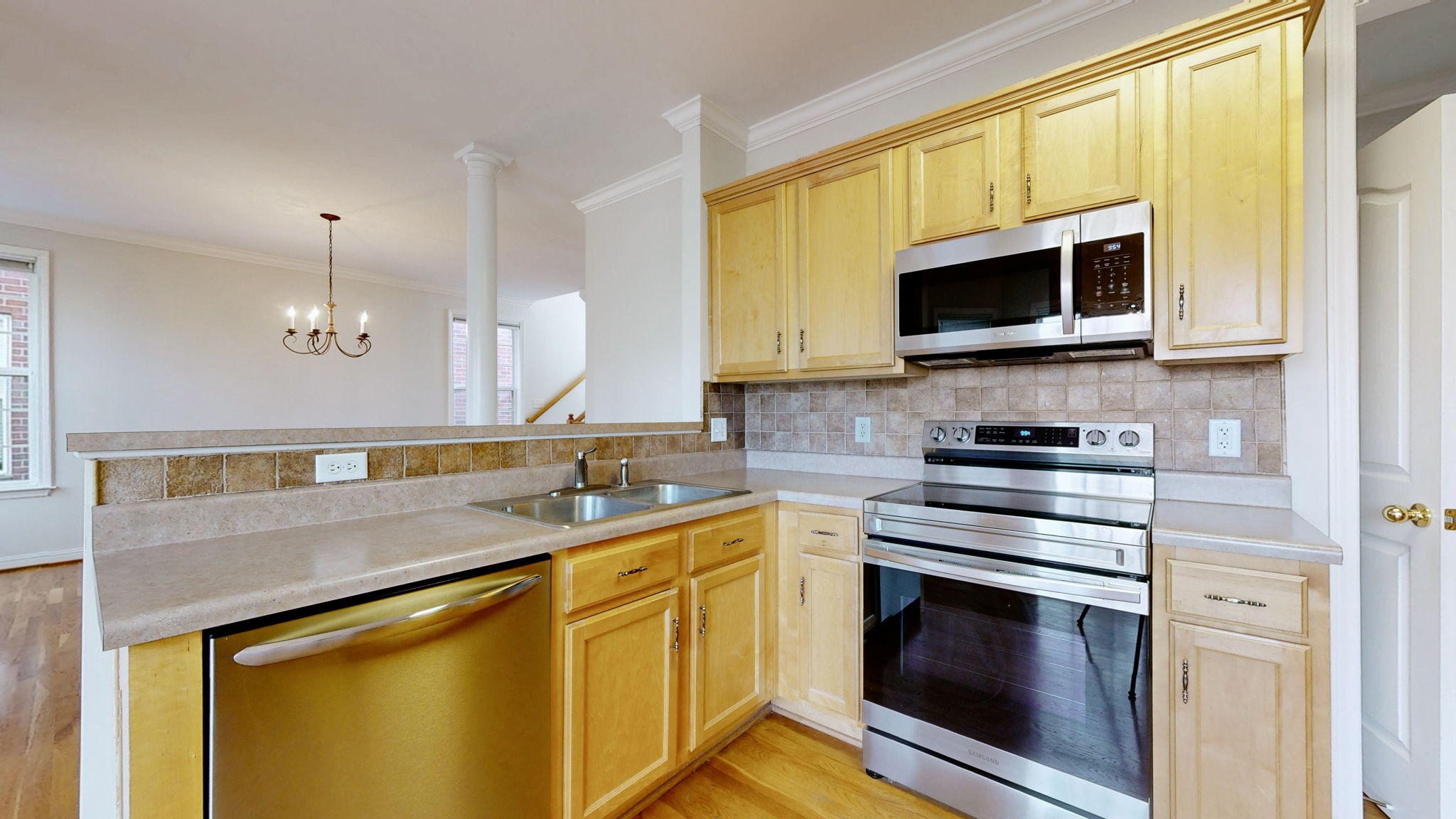 1138 Culpepper Circle Franklin, TN 37064 - Photo 9 of 46 a kitchen with stainless steel appliances granite countertop a sink stove and microwave