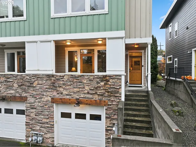 a front view of a house with stairs