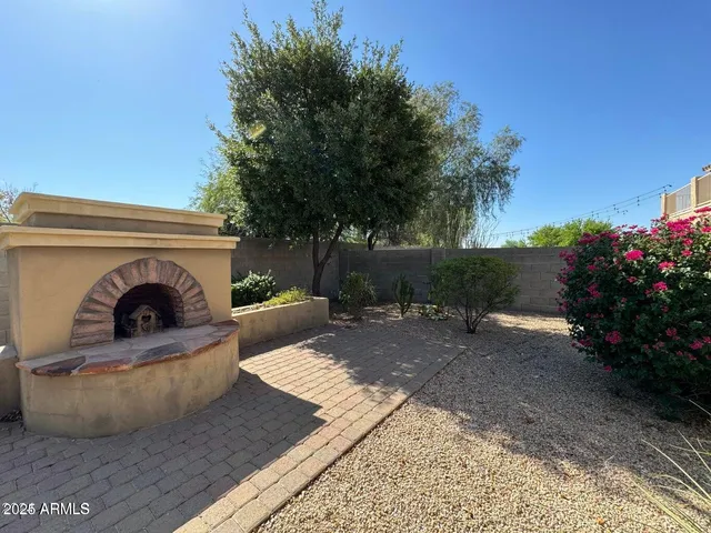 a view of a couches and a fire pit in the patio