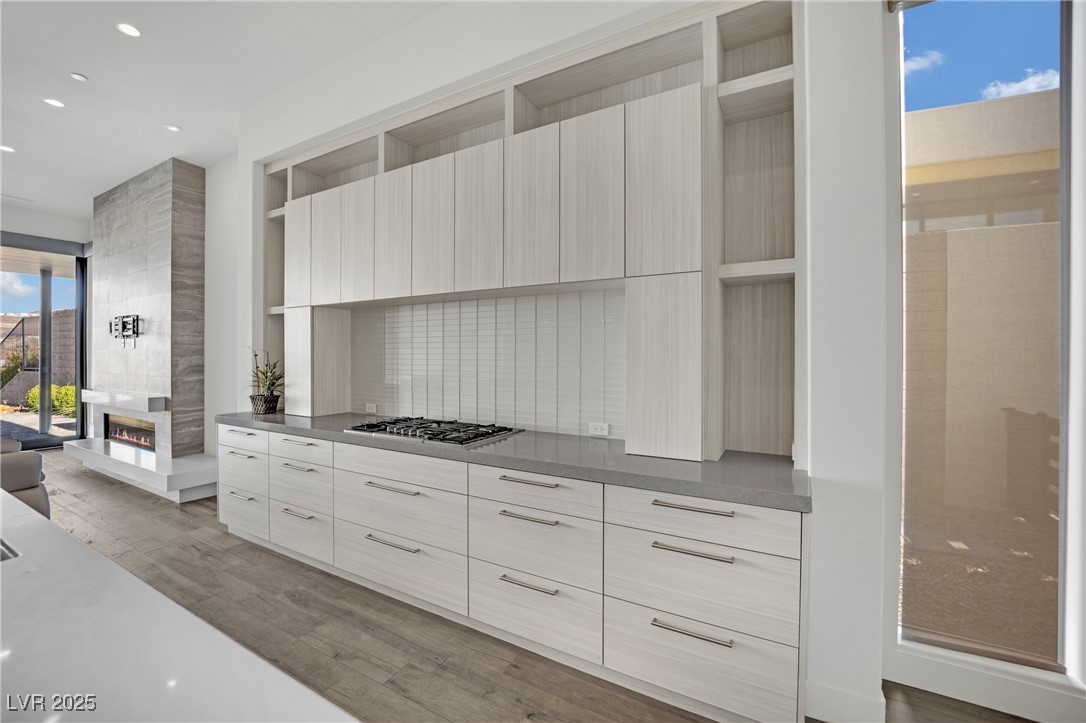 658 Falcon Summit Court Henderson, NV 89012 - Photo 14 of 99 Kitchen featuring modern cabinets, open shelves, dark wood-style floors, and recessed lighting