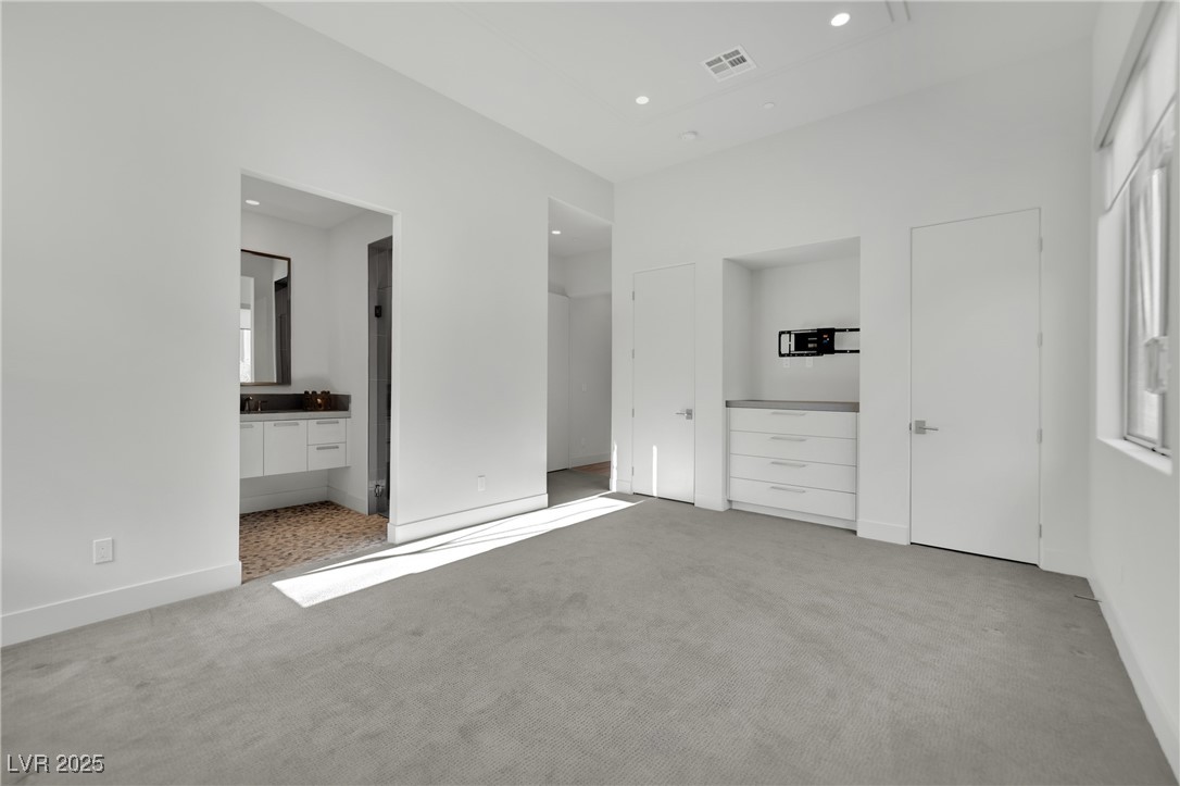 658 Falcon Summit Court Henderson, NV 89012 - Photo 45 of 99 Unfurnished bedroom featuring light colored carpet and recessed lighting