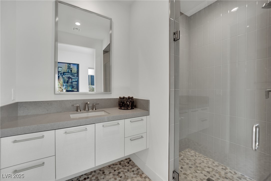 658 Falcon Summit Court Henderson, NV 89012 - Photo 46 of 99 Full bath with a stall shower, vanity, recessed lighting, and light tile patterned floors