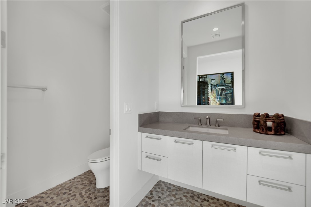 658 Falcon Summit Court Henderson, NV 89012 - Photo 47 of 99 Bathroom with vanity and light tile patterned floors