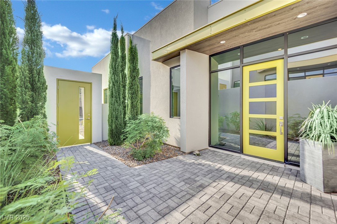 658 Falcon Summit Court Henderson, NV 89012 - Photo 5 of 99 Property entrance featuring stucco siding and a patio