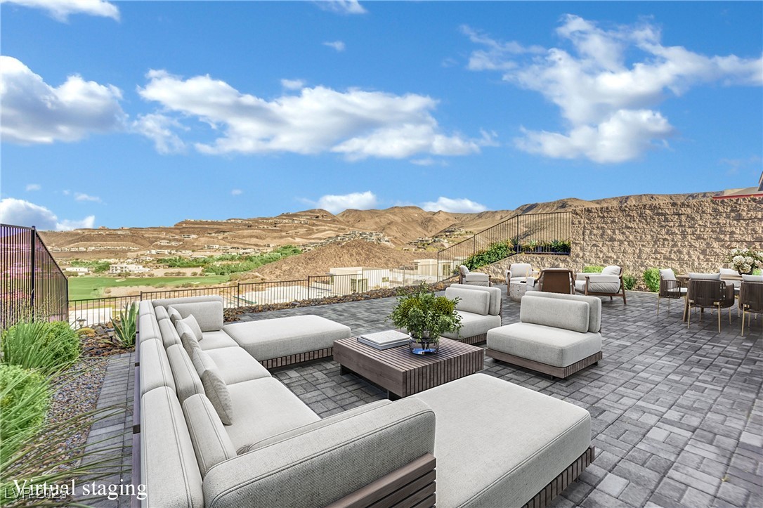 658 Falcon Summit Court Henderson, NV 89012 - Photo 54 of 99 View of patio with an outdoor hangout area and a mountain view