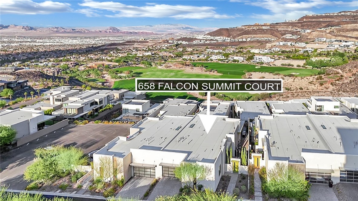 658 Falcon Summit Court Henderson, NV 89012 - Photo 70 of 99 Drone / aerial view of a mountainous background and a local golf course