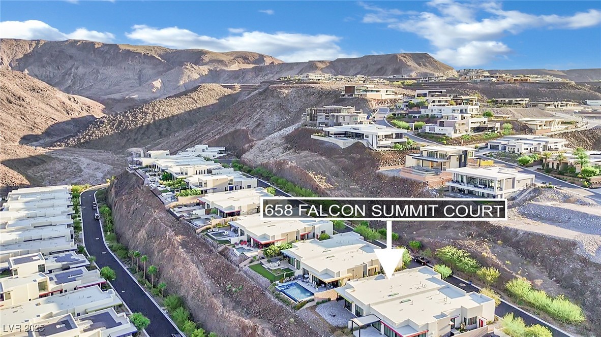 658 Falcon Summit Court Henderson, NV 89012 - Photo 72 of 99 Aerial view of residential area featuring a mountain backdrop