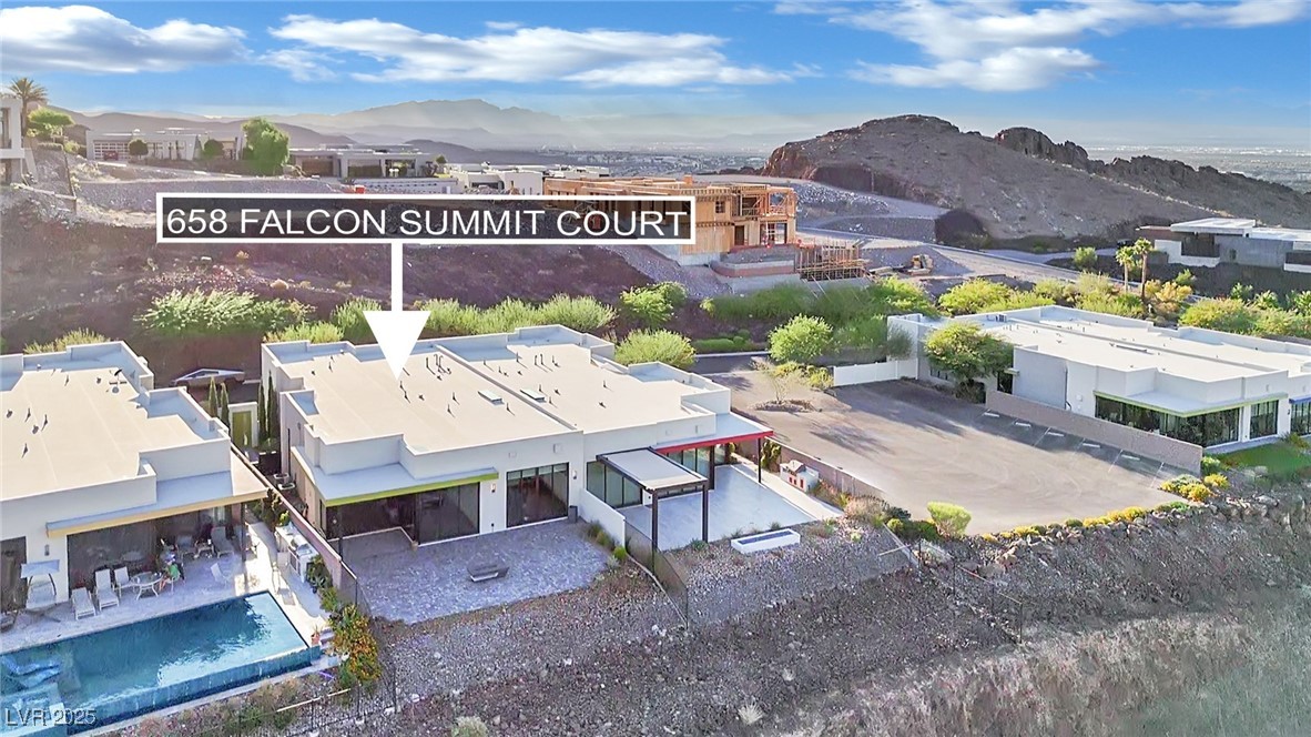 658 Falcon Summit Court Henderson, NV 89012 - Photo 73 of 99 View from above of property with a mountain backdrop