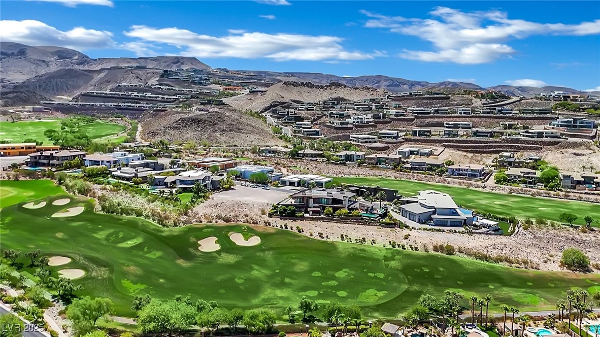 658 Falcon Summit Court Henderson, NV 89012 - Photo 78 of 99 Aerial perspective of suburban area with a golf club and mountains