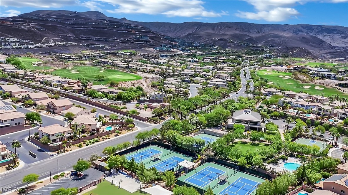 658 Falcon Summit Court Henderson, NV 89012 - Photo 80 of 99 Aerial perspective of suburban area with a golf club and a mountainous background