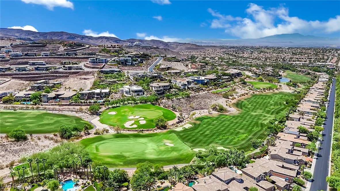 658 Falcon Summit Court Henderson, NV 89012 - Photo 81 of 99 Aerial perspective of suburban area featuring a mountain backdrop and a local golf course