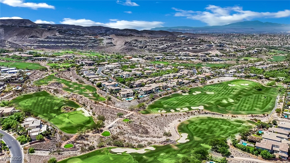 658 Falcon Summit Court Henderson, NV 89012 - Photo 85 of 99 Aerial overview of property's location with a mountain backdrop and nearby suburban area