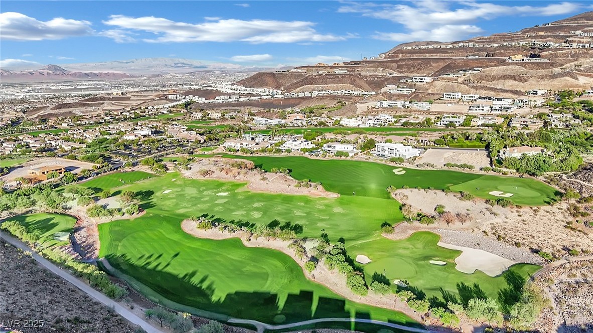658 Falcon Summit Court Henderson, NV 89012 - Photo 94 of 99 Aerial perspective of suburban area featuring a mountainous background and a golf club
