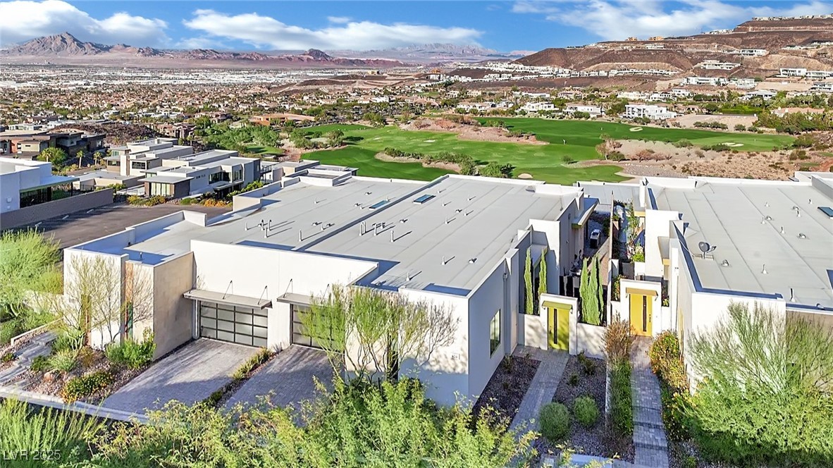 658 Falcon Summit Court Henderson, NV 89012 - Photo 96 of 99 Aerial perspective of suburban area with a mountain backdrop and a local golf course