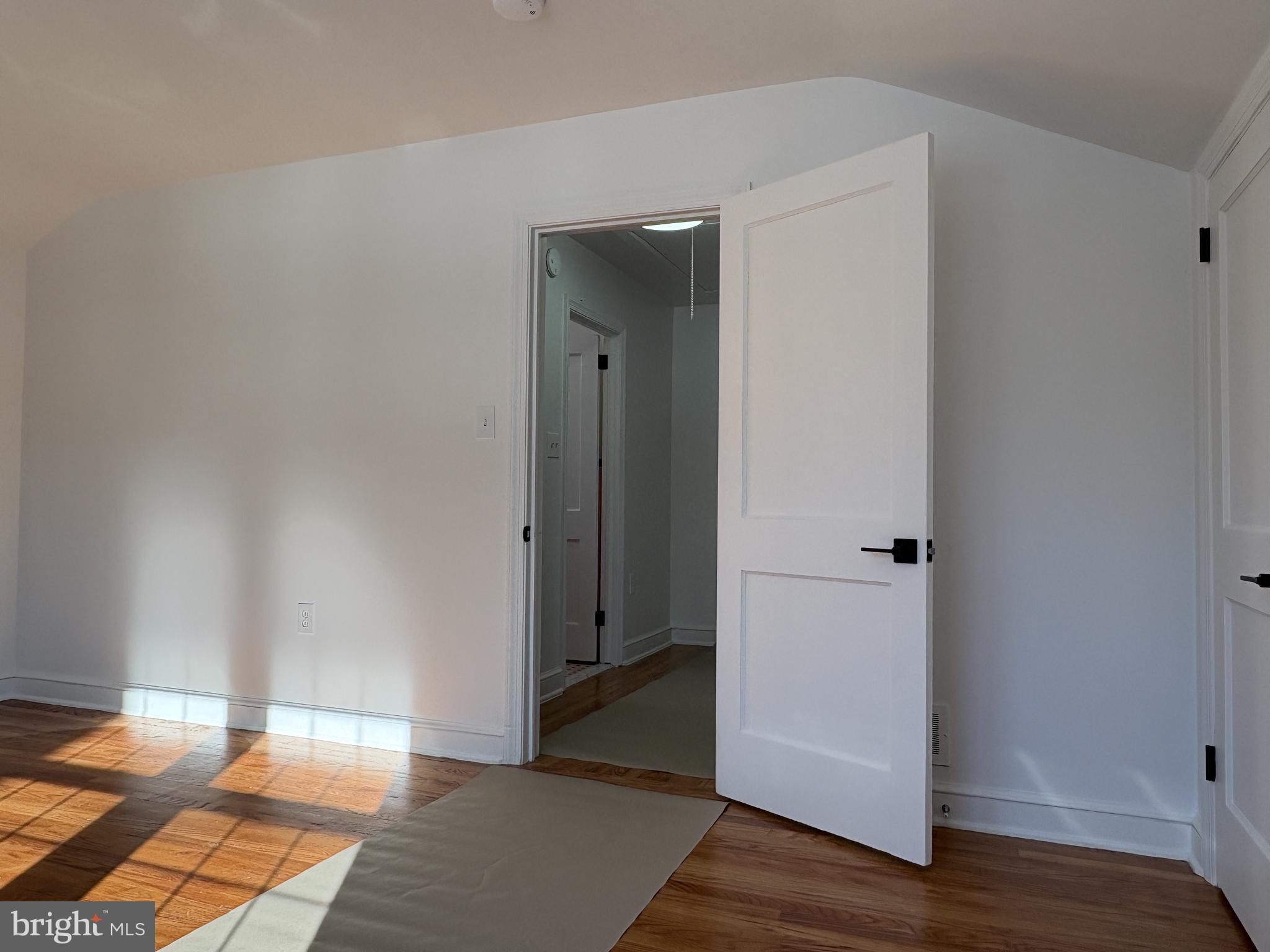 724 Brook Drive Newark, DE 19713 - Photo 35 of 37 an empty room with wooden floor and closet