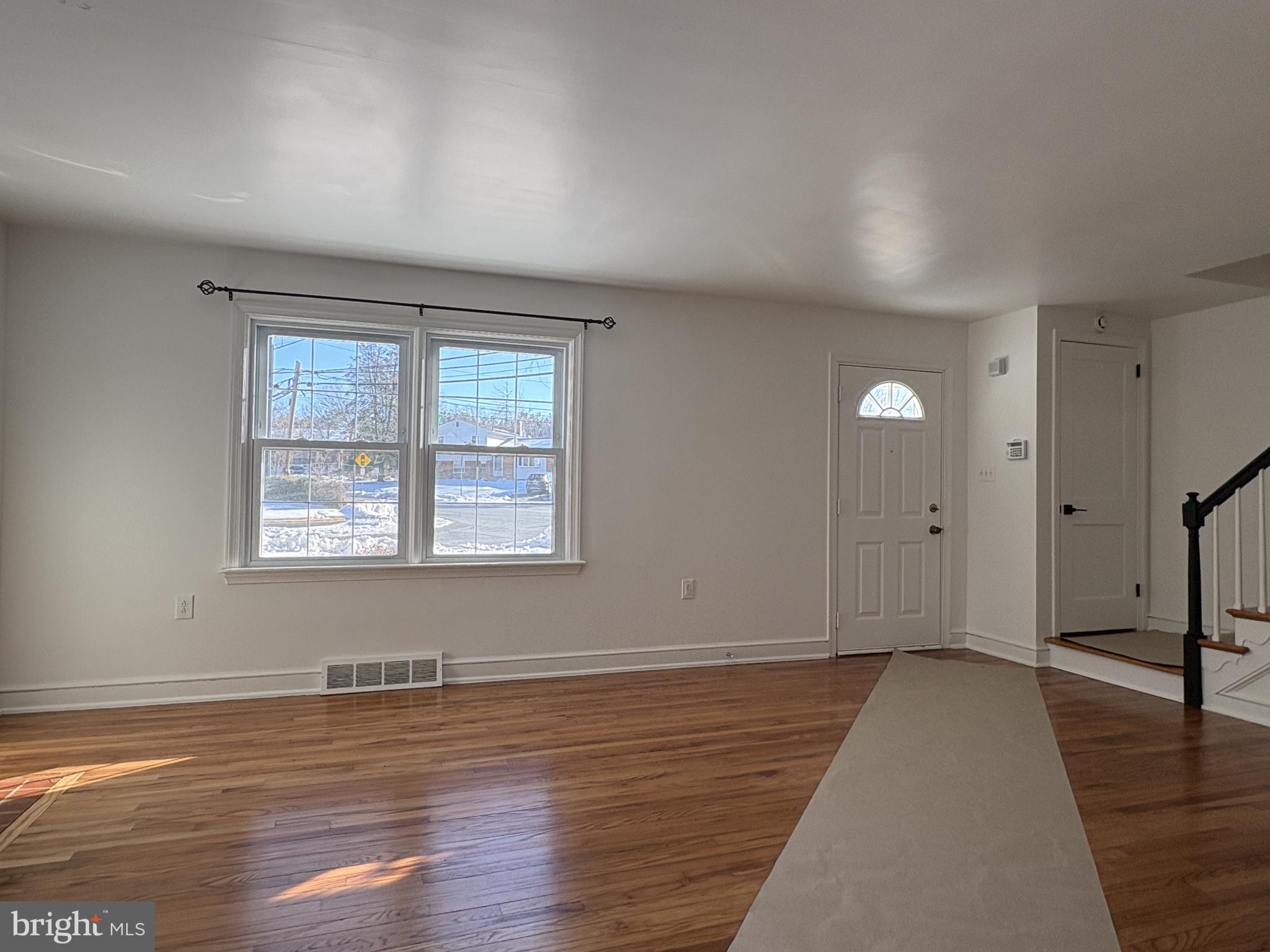 724 Brook Drive Newark, DE 19713 - Photo 4 of 37 wooden floor in an empty room with a window