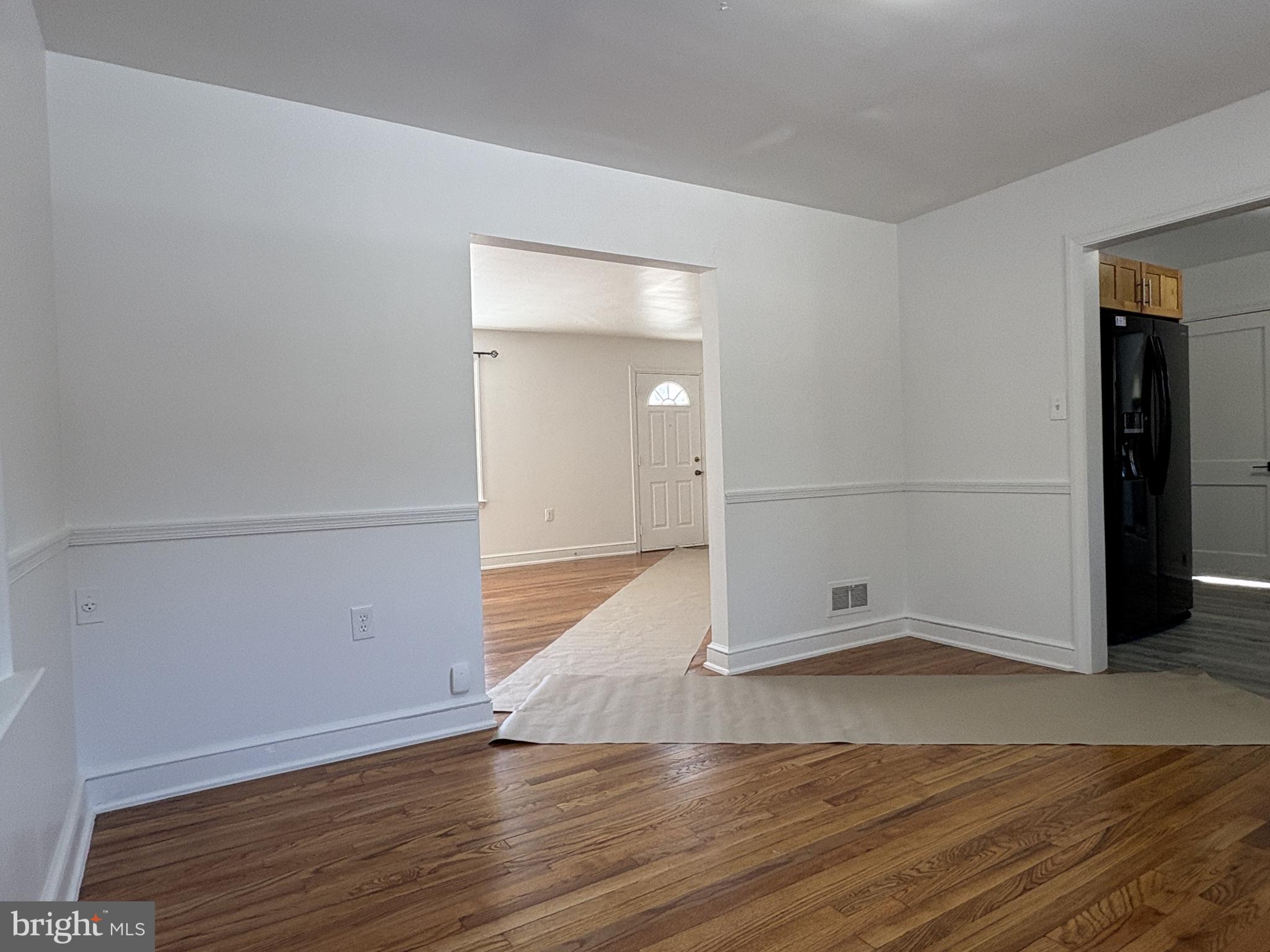 724 Brook Drive Newark, DE 19713 - Photo 9 of 37 an empty room with wooden floor