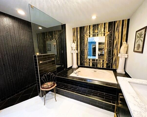 150 Cape Pointe Circle Jupiter, FL 33477 - Photo 12 of 22 a room with table closet and wooden floor