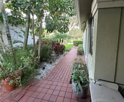 a view of a pathway with a yard