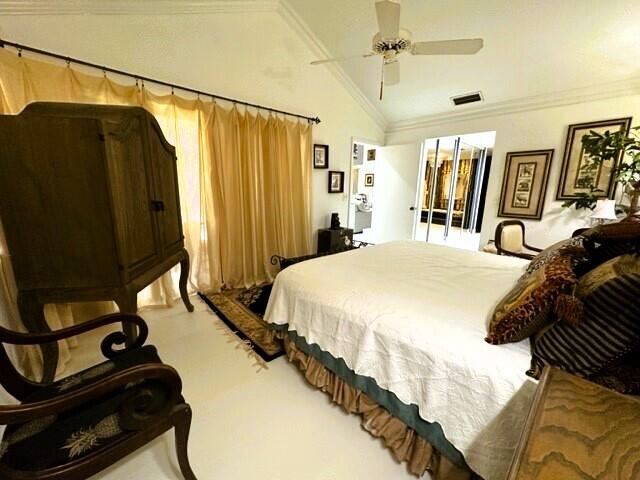 150 Cape Pointe Circle Jupiter, FL 33477 - Photo 9 of 22 a bedroom with a bed and a walk in closet