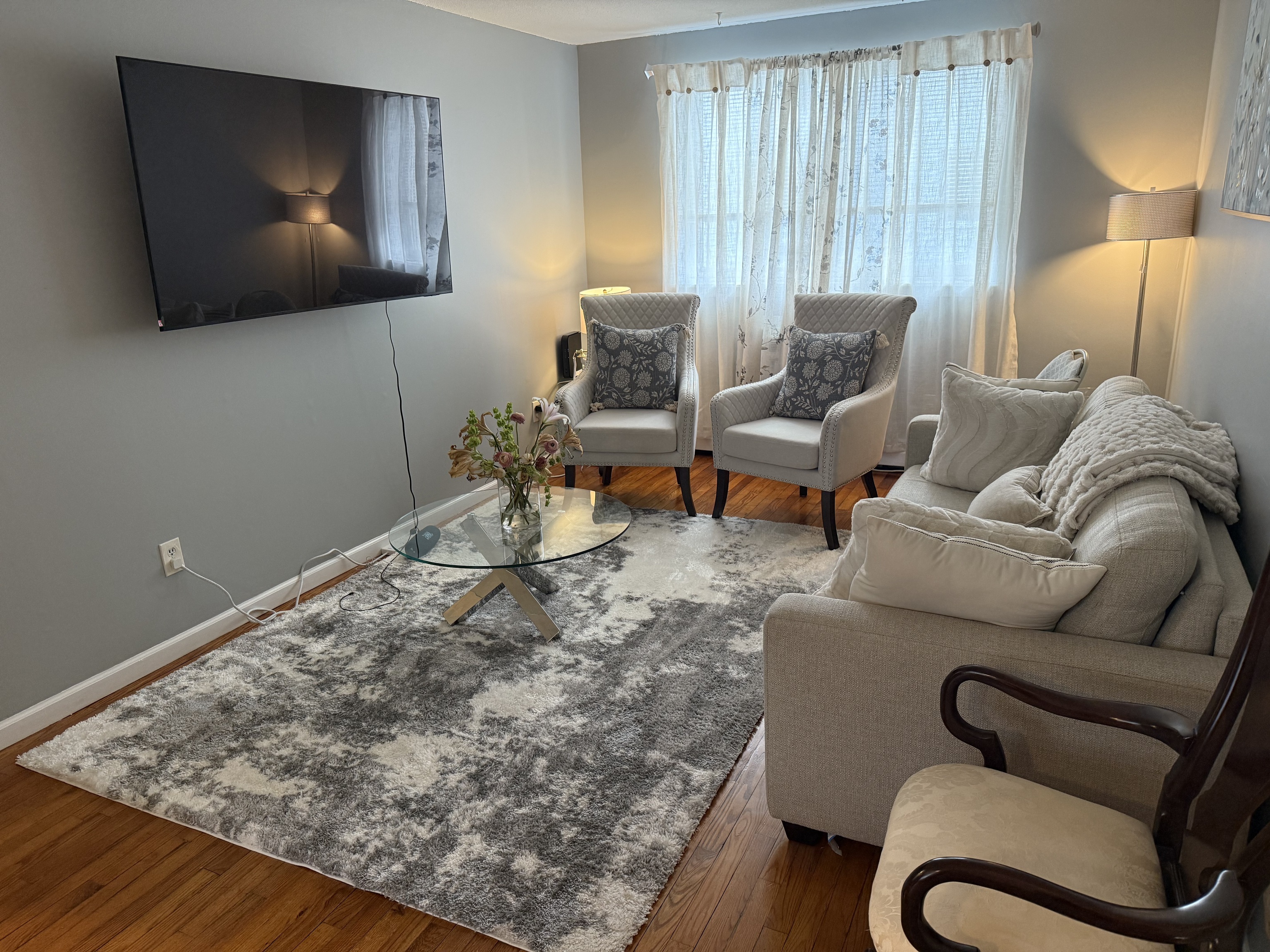 4 Van Zant Street, Unit B8 Norwalk, CT 06855 - Photo 1 of 15 a living room with furniture and a flat screen tv