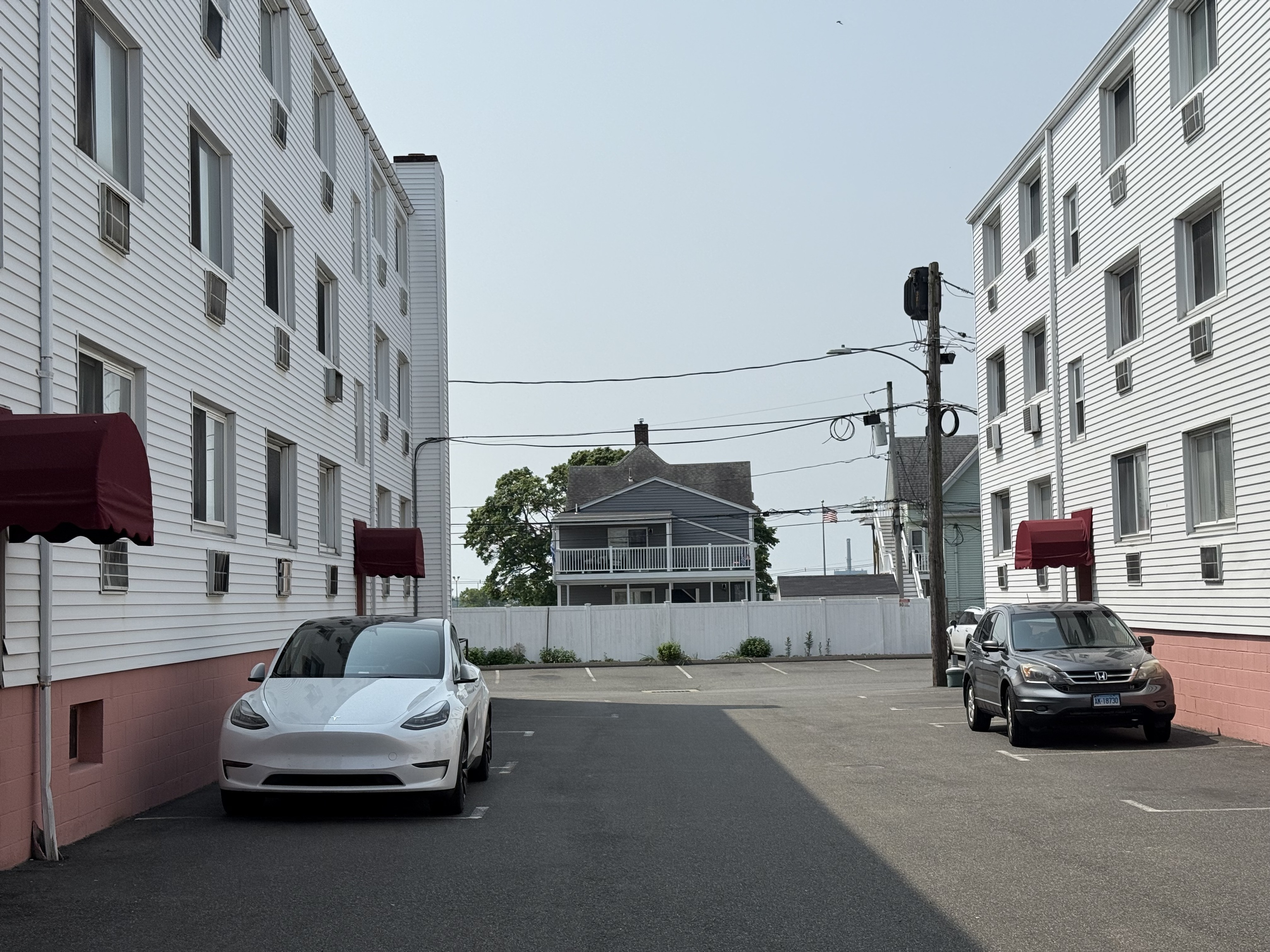 4 Van Zant Street, Unit B8 Norwalk, CT 06855 - Photo 5 of 15 a car parked in front of a building