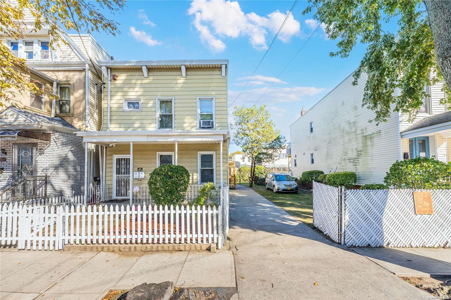 88-19 76th Street Queens, NY 11421 - Photo 1 of 1 a front view of a house with a porch