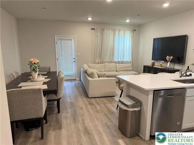 a living room with a couch and a flat screen tv