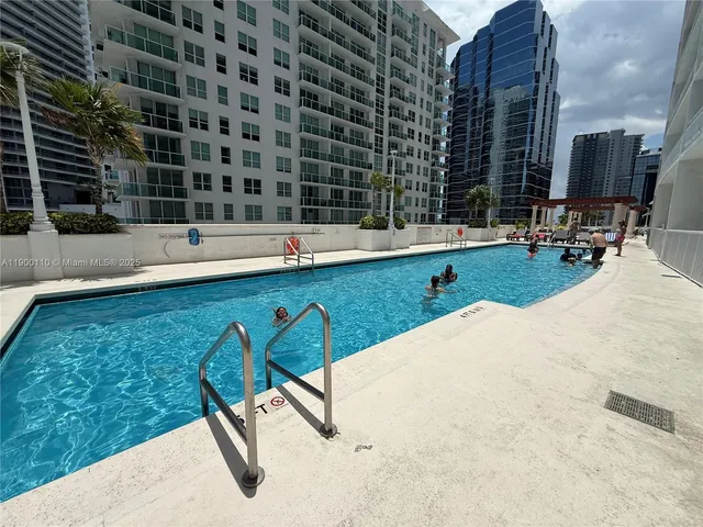 a view of a swimming pool with chairs