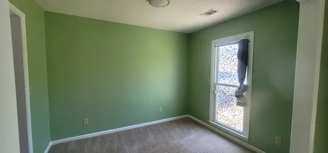 a view of an empty room and window