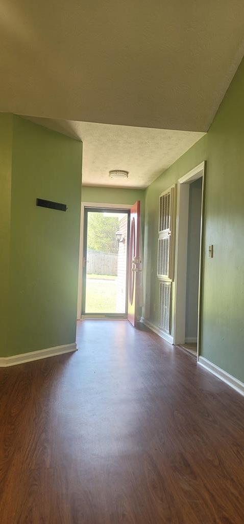 798 Omega Drive Columbus, GA 31907 - Photo 9 of 14 an empty room with wooden floor and windows