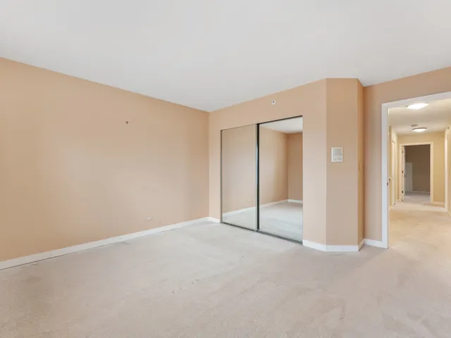 an empty room with a bathroom