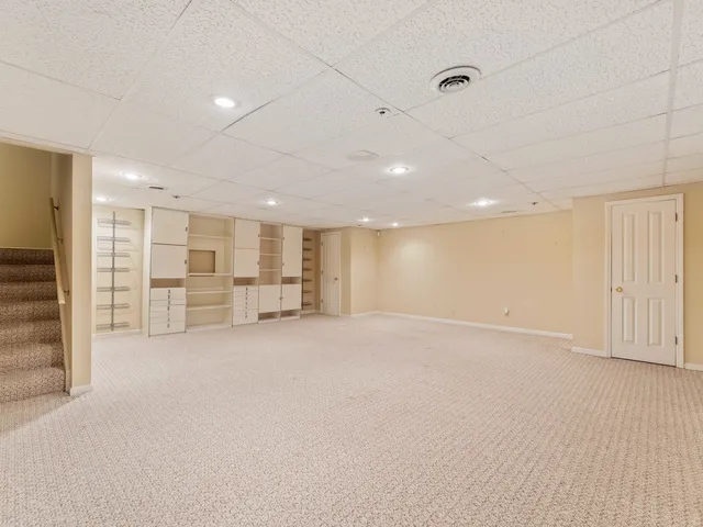 a view of an empty room with a cabinet