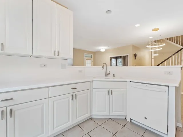a kitchen with white cabinets