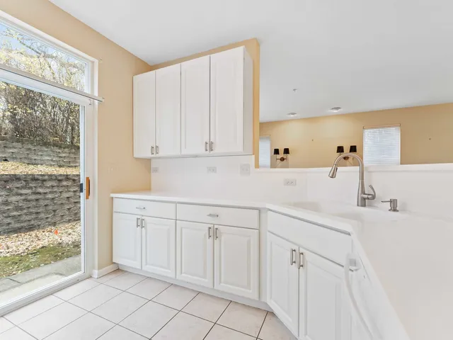 a kitchen with white cabinets
