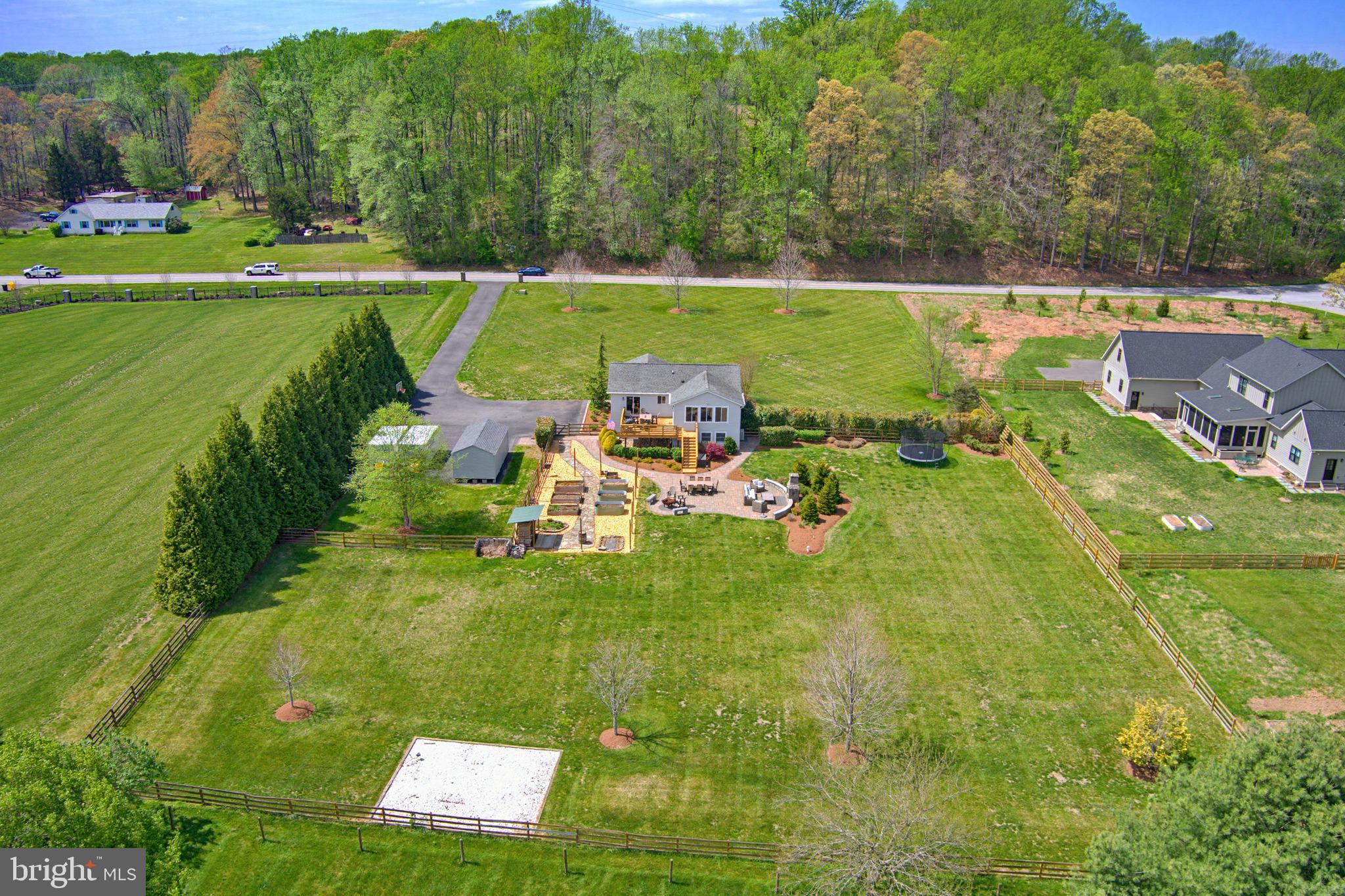 3229 Beards Point Road Davidsonville, MD 21035 - Photo 17 of 69 a view of a swimming pool and a yard