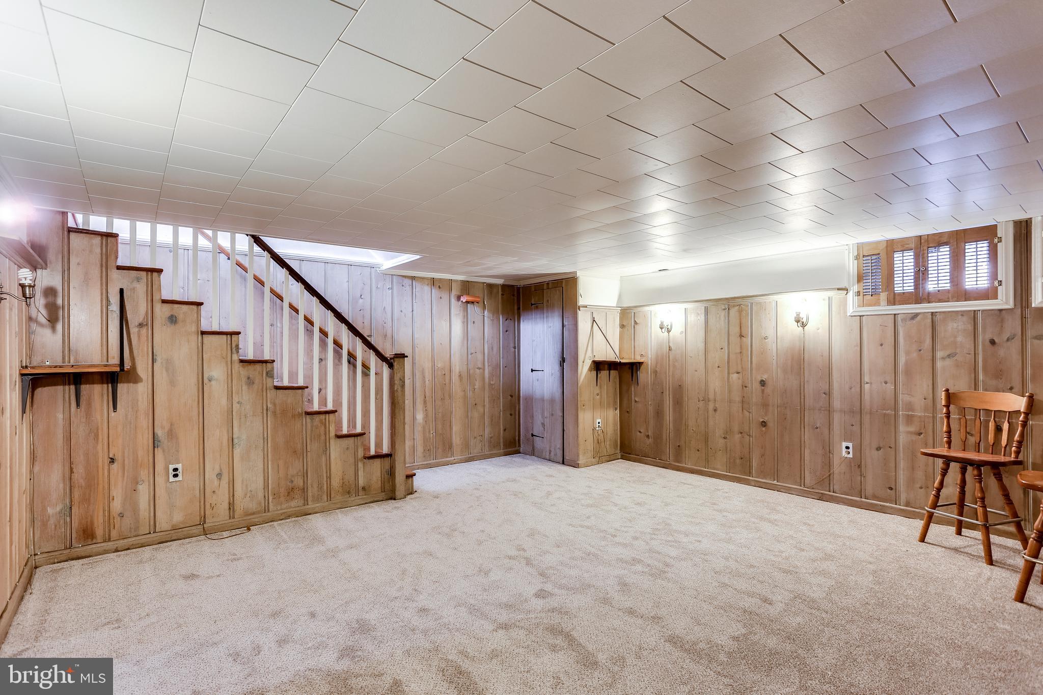 425 Stratford Road Baltimore, MD 21228 - Photo 21 of 30 Recreation Room with Light Knotty Pine Panel