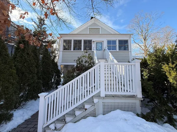 a view of a house with backyard and porch
