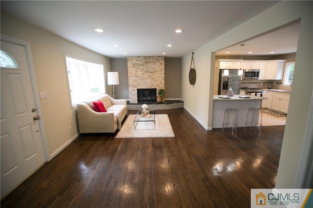 6 Brookside Road Edison, NJ 08817 - Photo 3 of 24 a room with wooden floor and white walls