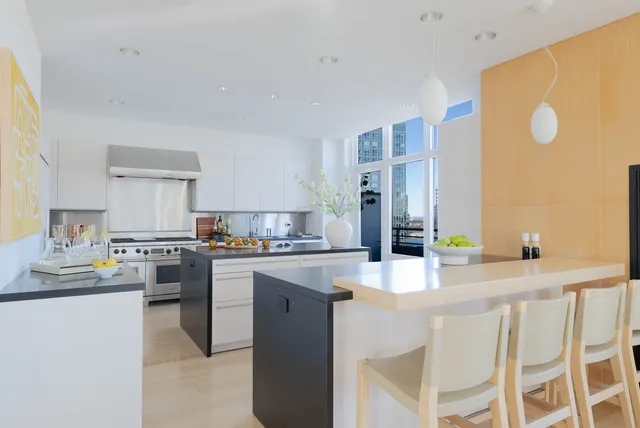 a dining room with furniture a window and appliances