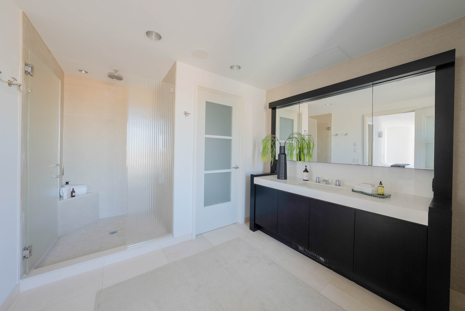 555 West 59th Street, Unit PHC Manhattan, NY 10019 - Photo 18 of 27 a bathroom with a double vanity sink mirror and shower